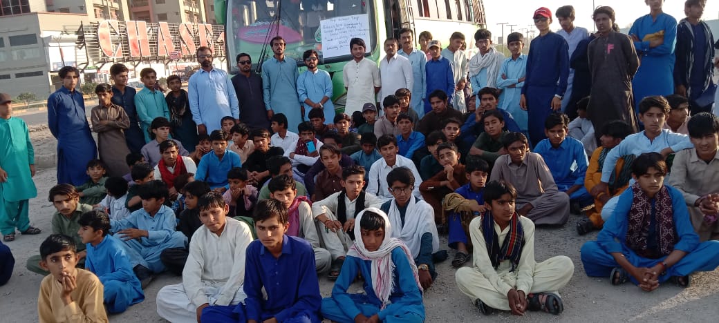 Group of students preparing to board the school trip bus